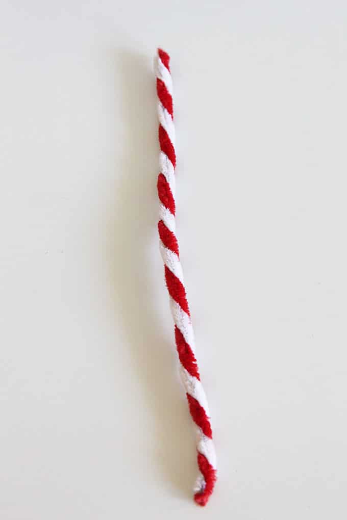 Red and white pipe cleaners twisted together.
