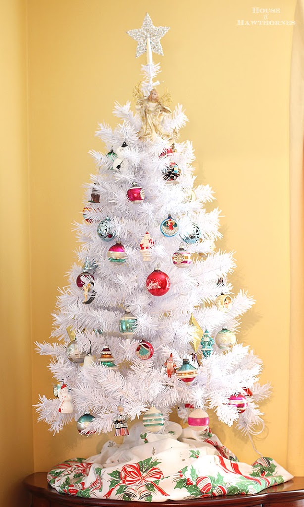 A white Christmas tree with vintage Shiny Brite ornaments creates a modern retro holiday look that fits in with any home decor style for the holiday season!