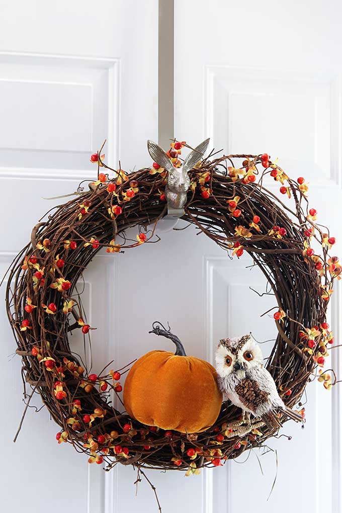Make this quick and easy fall grapevine wreath for your front door. An inexpensive DIY project that can be done in less than 10 minutes.