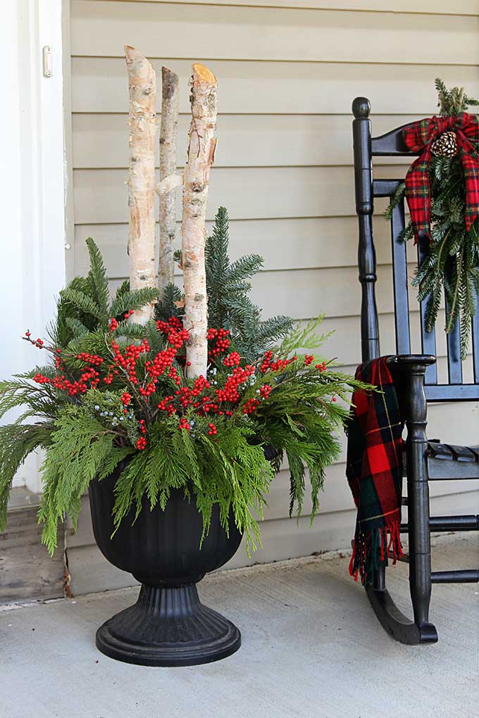 DIY outdoor Christmas planters for your holiday porch #ChristmasDecor #porch #porchdecor #containergardening #winterdecor #gardeningideas